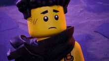 a yellow lego figure with a black scarf around his neck