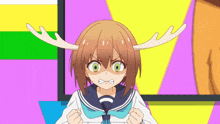 a girl with antlers on her head is making a funny face