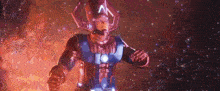 a superhero is standing in the middle of a galaxy surrounded by stars and fire .
