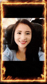 a picture of a woman with a fire frame around her face