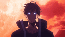 a man with blue eyes is standing in front of a sunset