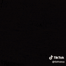 a blurry picture of a person 's face with a tiktok logo in the corner