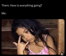 a little girl is making a funny face with her finger on her forehead and the caption says them how is everything going me