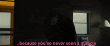 a man standing in a dark room with the words because you 've never seen a miracle below him