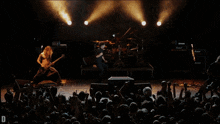 a band on stage with a marshall amplifier in the back