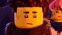 a close up of a lego man 's face with a sad look on his face