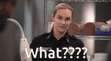 a woman in a police uniform is holding a vacuum cleaner and says what ?