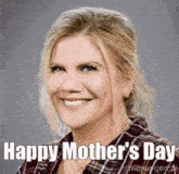 a woman is smiling and says happy mother 's day