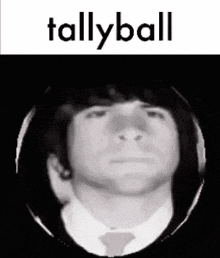 a black and white photo of a man in a suit and tie with the words `` tallyball '' written above him .