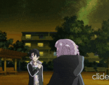 a couple of anime characters standing in front of a building with the word cide in the corner