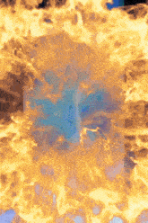 a blue object is surrounded by flames that are orange and yellow
