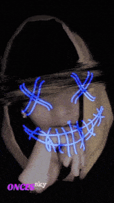 a person wearing a mask that says once sky on the bottom right