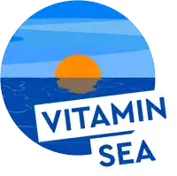 a logo for vitamin sea shows a sunset in the ocean