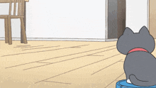 a cartoon cat is sitting on a blue robotic vacuum