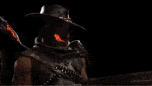 a man in a cowboy hat is riding a blue horse in a dark room .
