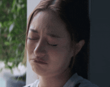 a woman with tears running down her face