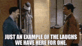 two men are standing next to each other in a hallway with the words just an example of the laughs we have here for one