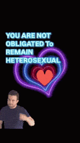 a man is standing in front of a neon heart that says you are not obligated to remain heterosexual