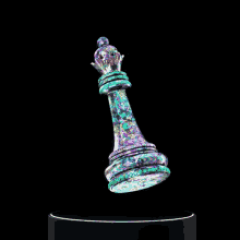 a colorful chess piece with a crown on top of it