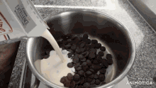 milk is being poured into a pot with chocolate chips