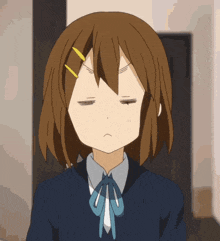a close up of a girl 's face with a serious look on her face