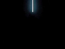 a silhouette of a man in a dark room