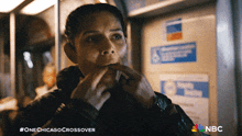 a poster for one chicago crossover shows a woman on a bus