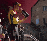 a man drinking from a can that says storia