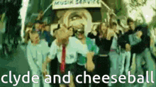 a group of people are standing in front of a sign that says musik service