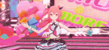 a girl is dancing on a stage in front of a sign that says more .