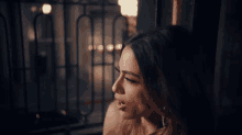 a woman is looking out a window with her mouth open