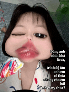 a picture of a girl with a lollipop in her mouth and the words " anh có ny chua " below her