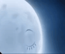 a close up of a moon with a drawing of a person sleeping on it .