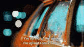 a close up of a car with the words " i 'm afraid of the world " written on it