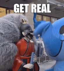 a statue of a woman is being attacked by a stuffed animal with the words get real above it