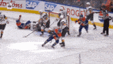 a hockey game is being played on a ice rink with advertisements for sap and pepsi