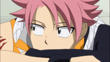 a cartoon character with pink hair is laying down with his head resting on his arm