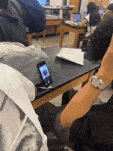 a cell phone with a picture of a boy on it
