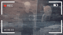 a video of a man and a girl is being recorded at a time of 00 : 06 : 03