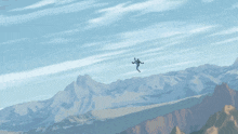 a person is flying through the air over a snowy mountain range
