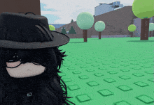 a person wearing a black hat and sunglasses is standing in a field