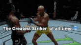 two men are fighting in a boxing ring with the words " the greatest striker of all time " below them