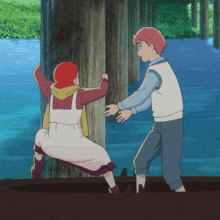 a boy and a girl are standing next to a wooden post