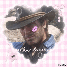 a picture of a man in a cowboy hat with a pink kiss on his face