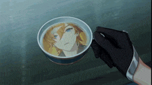 a person is holding a cup with a picture of a boy inside of it
