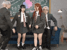 a group of people are standing in front of a blackboard that says " nice to meet you "
