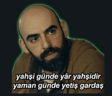 a bald man with a beard has a sticker that says yahshi gunde yar yahshidir
