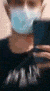 a blurry image of a person wearing a face mask