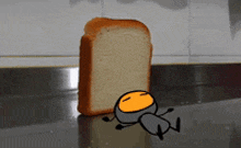 a cartoon of a person laying on a counter next to a slice of bread