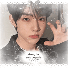 zhang hao solo de paris is written on a picture of a boy
